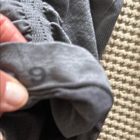 Two pair of Lululemon In The Flow- Cropped Gray and Black Leggings - Picture 4 of 4